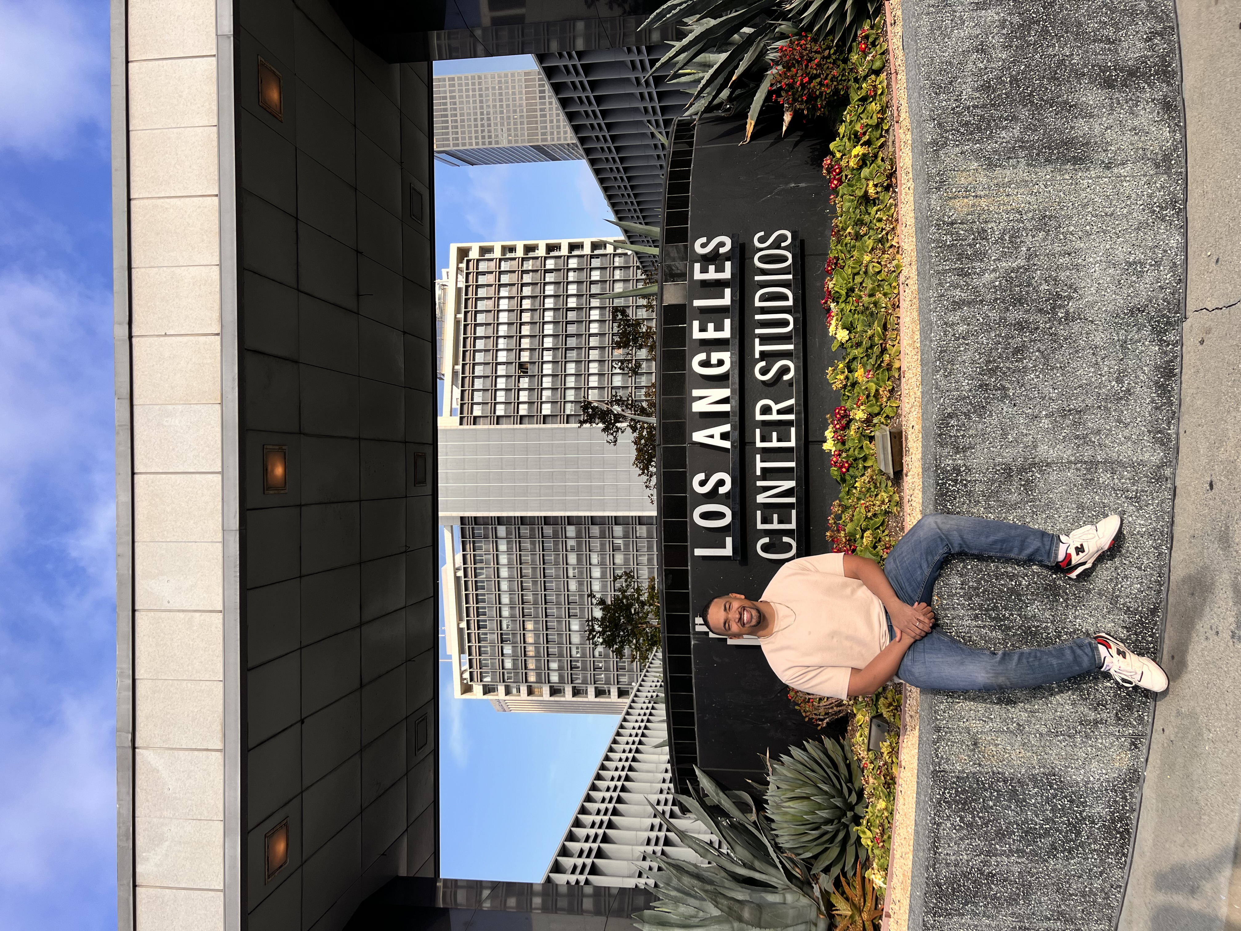 Jared Langley smiling in front of Los Angeles Center Studios